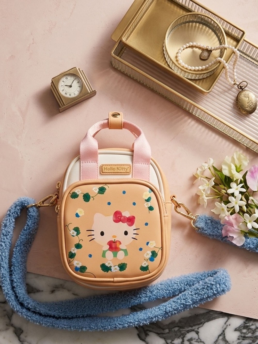 Hello Kitty Crossbody Bag with Pink Handles and clasp.